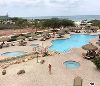 ARUBA CARIBBEAN PALM VILLAGE  Flying off to one of the worlds most-visited places is just the start of living your dream